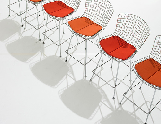 Bertoia barstools with red seat pad